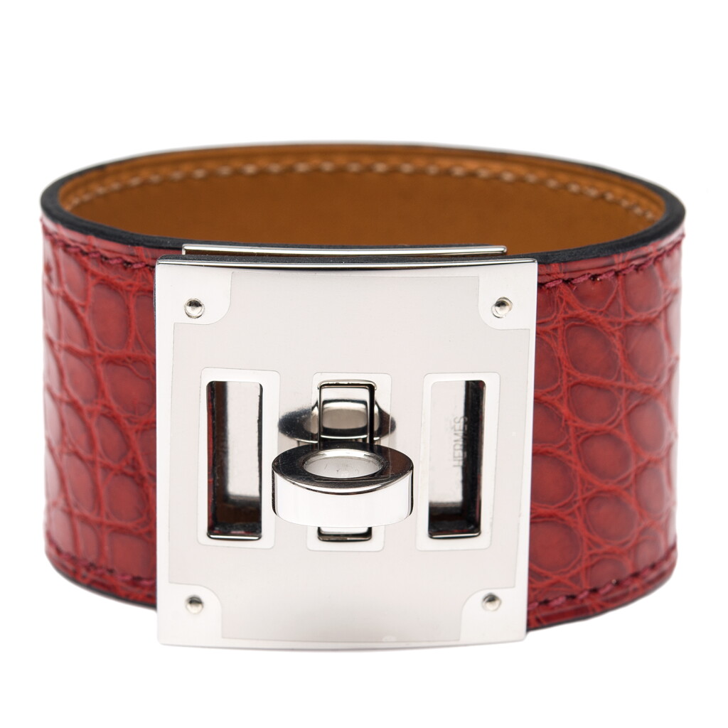 View full screen - View 1 of Lot 93. Hermès Rouge H Kelly Dog Bracelet of Matte Mississipiensis Alligator Kelly Dog Bracelet with Palladium Hardware.