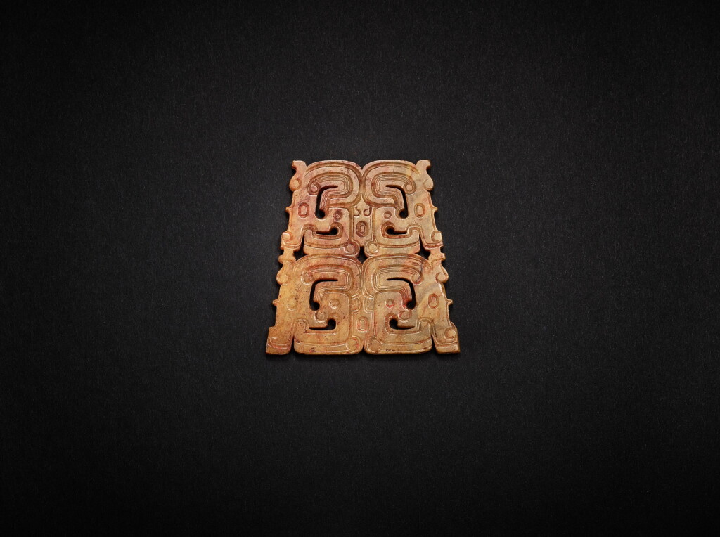 View full screen - View 1 of Lot 3810. A yellowish-celadon jade openwork 'human-dragon' plaque, Mid - late Western Zhou dynasty | 西周中晚期 淺青黃玉透雕人首龍紋項佩飾.