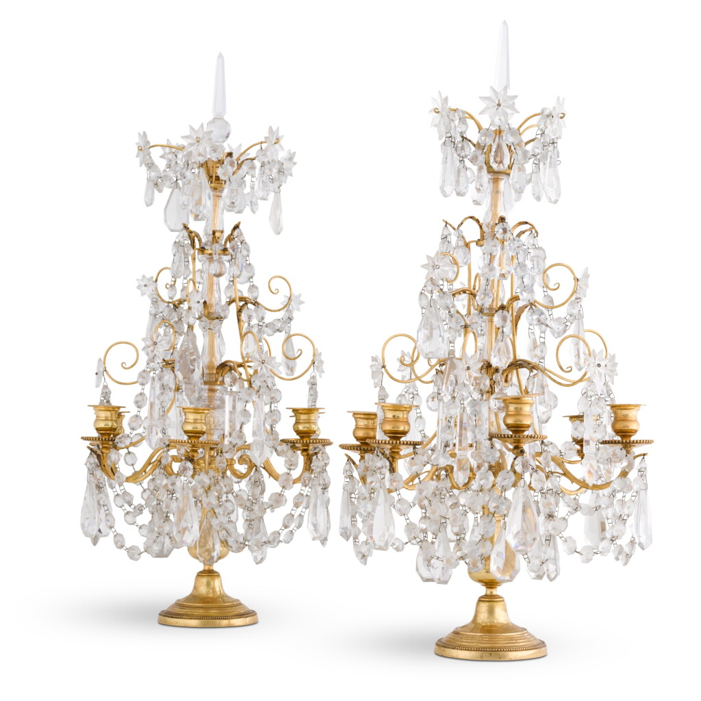 View full screen - View 1 of Lot 39. A pair of Régence style cut-glass and gilt-metal six-light girandoles.