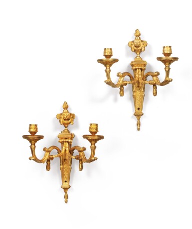 View full screen - View 1 of Lot 214. A pair of gilt-bronze two-light wall lights, Louis XV, circa 1770 | Paire d'appliques à deux lumières en bronze doré d'époque Louis XV, vers 1770.