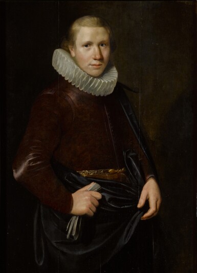 View full screen - View 1 of Lot 112. Portrait of a young man in a millstone collar, holding gloves, his right arm akimbo, three-quarter length.