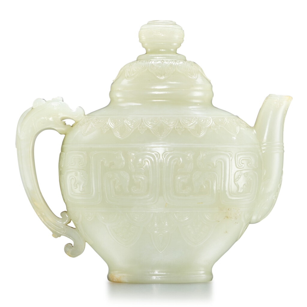 View full screen - View 1 of Lot 18. An archaistic white jade teapot and cover, Qing dynasty, 19th century | 清十九世紀 白玉雕仿古夔龍紋茶壺.