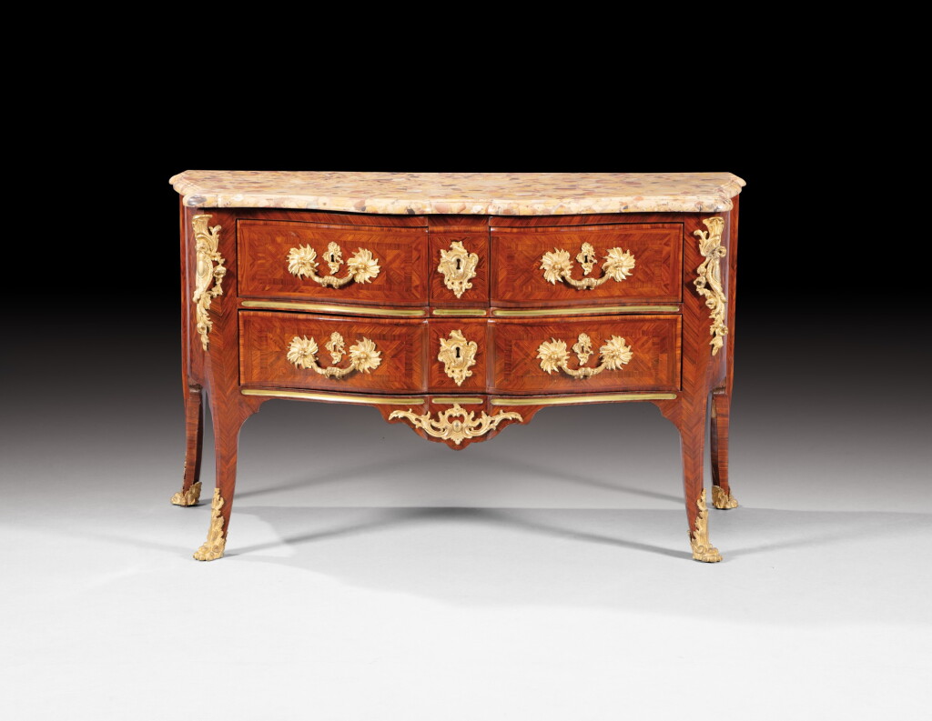 View full screen - View 1 of Lot 31. A gilt-bronze mounted and kingwood commode, French Régence, circa 1720, stamped 'I.D' for Jacques Denizot | Commode en placage de bois de violette et bronze doré d'époque Régence, vers 1720, estampillée "I. D" pour Jacques Denizot.