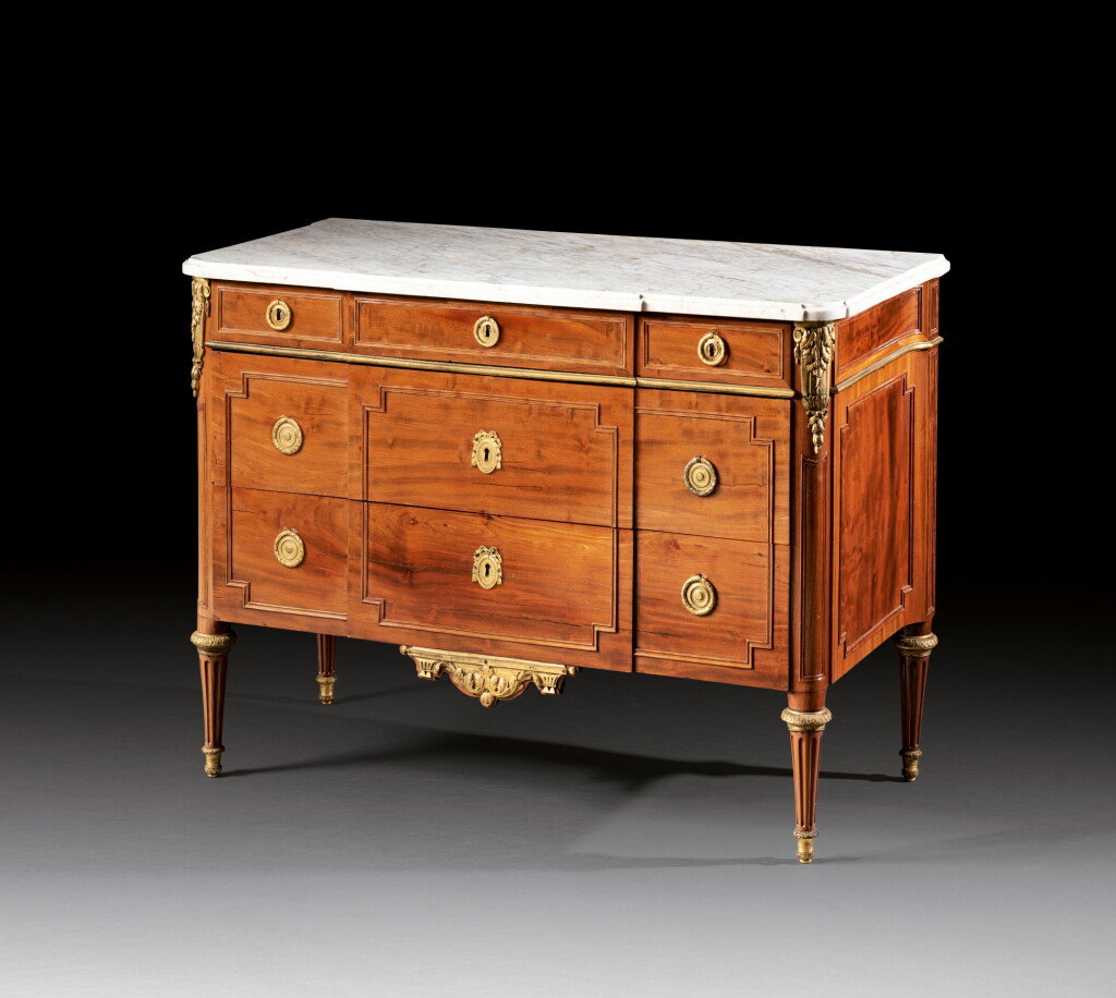 View full screen - View 1 of Lot 122. A Louis XVI mahogany and gilt-bronze commode, circa 1780, stamped 'J.H RIESENER' | Commode en acajou et bronze doré d'époque Louis XVI, vers 1780, estampillée "J.H. RIESENER".