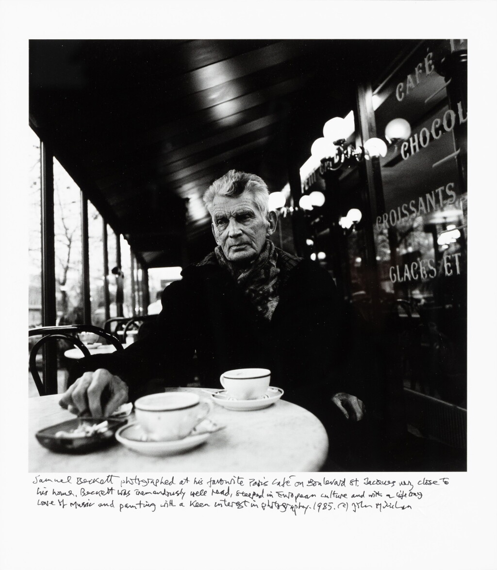 View full screen - View 1 of Lot 1. Samuel Beckett Seated in Café Français, Boulevard St. Jacques, Paris, 1985 | Samuel Beckett assis au Café Français, Boulevard St. Jacques, Paris, 1985.