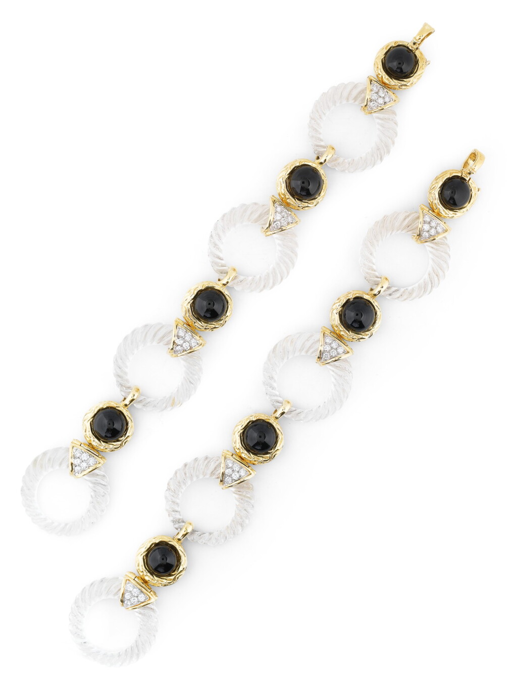 View full screen - View 1 of Lot 135. BOUCHERON | PAIRE DE BRACELETS CRISTAL DE ROCHE, ONYX ET DIAMANTS | PAIR OF ROCK CRYSTAL, ONYX AND DIAMOND BRACELETS.