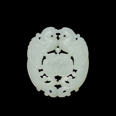 View full screen - View 1 of Lot 3703. An inscribed white jade 'phoenix' plaque, Qing dynasty, 18th - 19th century | 清十八至十九世紀 白玉鏤雕鳳凰「同心好合」珮.