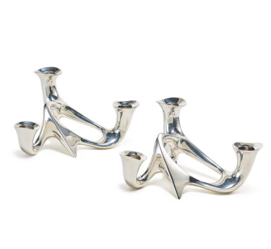 View full screen - View 1 of Lot 442. A Pair of Danish Silver Three-Light Candelabra, No. 956, Designed by Henning Koppel, Georg Jensen Silversmithy, Copenhagen, 1945-77.
