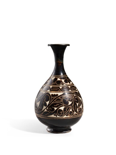 View full screen - View 1 of Lot 2071. A Cizhou-type black-glazed sgraffiato 'fish' bottle vase, Jin dynasty | 金 磁州窰系黑釉剔牡丹魚紋玉壺春瓶.