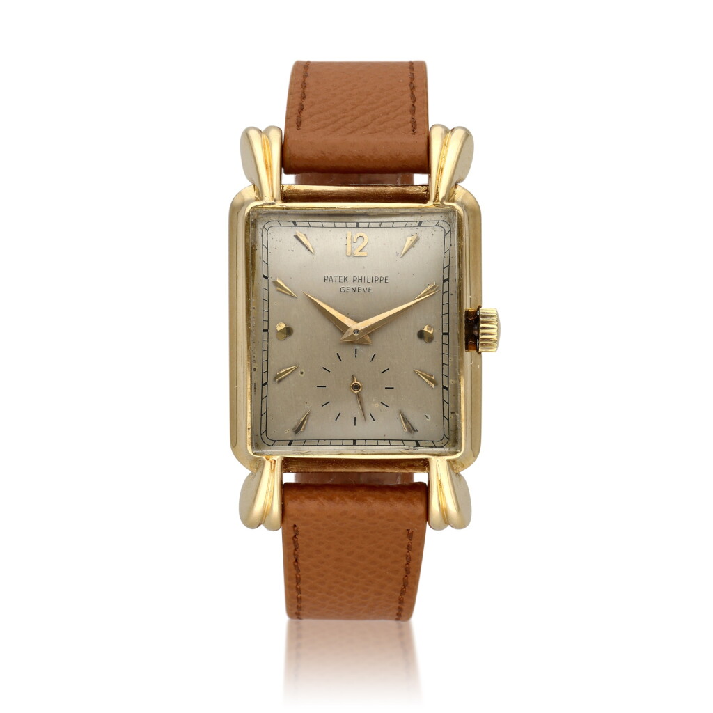 View full screen - View 1 of Lot 275. Reference 2440 ‘Clubs’ | A large yellow gold rectangular wristwatch with fluted lugs, Circa 1950 .