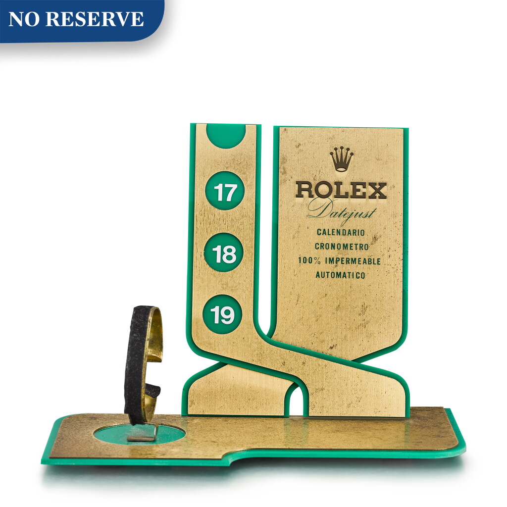 View full screen - View 1 of Lot 8069. ROLEX | REFERENCE 386 A GILT BRASS, GREEN ENAMEL AND PLASTIC RETAILER'S WINDOW DISPLAY, CIRCA 1970.