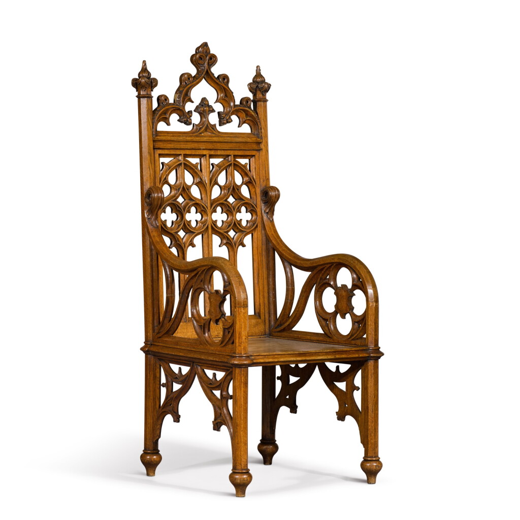 View full screen - View 1 of Lot 128. An early Victorian Gothic Revival carved oak armchair, mid-19th century, in the manner of A.W.N. Pugin.