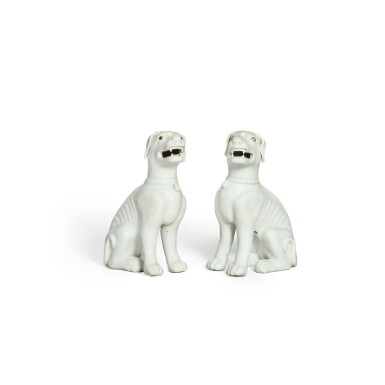 View full screen - View 1 of Lot 371. A pair of white-glazed figures of seated hound, Qing dynasty, 18th/ 19th century | 清十八 / 十九世紀 白釉坐犬一對.