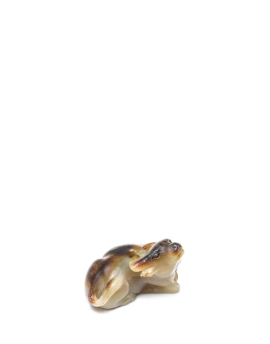 View full screen - View 1 of Lot 3910. A small celadon and russet jade figure of a buffalo, Song dynasty | 宋 青白玉帶皮臥牛.