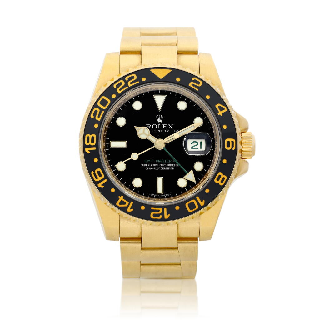 View full screen - View 1 of Lot 2063. GMT-Master II, Reference 116718 | A brushed yellow gold dual time zone wristwatch with date and bracelet, Circa 2008, Formerly in the collection of Eric Clapton, CBE | 勞力士 | GMT-Master II 型號116718 | 黃金兩地時間鏈帶腕錶,備日期顯示,約2008年製,原為 Eric Clapton, CBE 收藏.