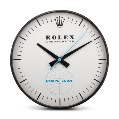 View full screen - View 1 of Lot 8136. HANDOVER MANUFACTURE INC FOR ROLEX | REFERENCE G-062, A LARGE BLACKENED METAL WALL CLOCK, MADE FOR PAN-AM AMERICAN AIRWAYS, CIRCA 1965.