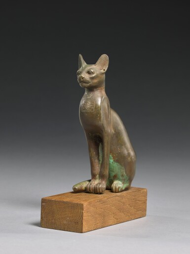 View full screen - View 1 of Lot 64. AN EGYPTIAN BRONZE FIGURE OF A CAT, 21ST/26TH DYNASTY, 1075-525 B.C..