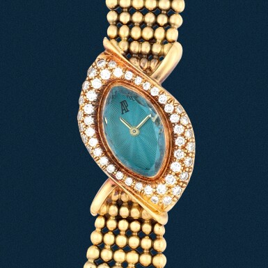View full screen - View 1 of Lot 6. 'Baroque' | An asymmetrical marquise-shaped yellow gold, diamond-set and blue crystal glass bracelet watch | Circa 1990.