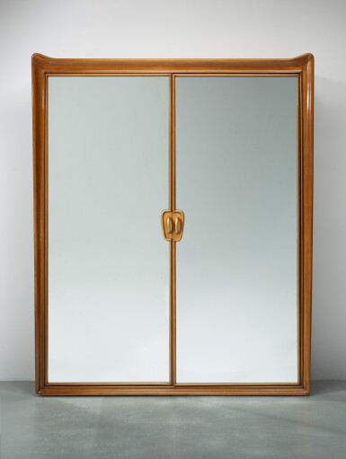 View full screen - View 1 of Lot 56. Built-in wardrobe cabinet, with five sculpted walnut hungers and six brass hook .
