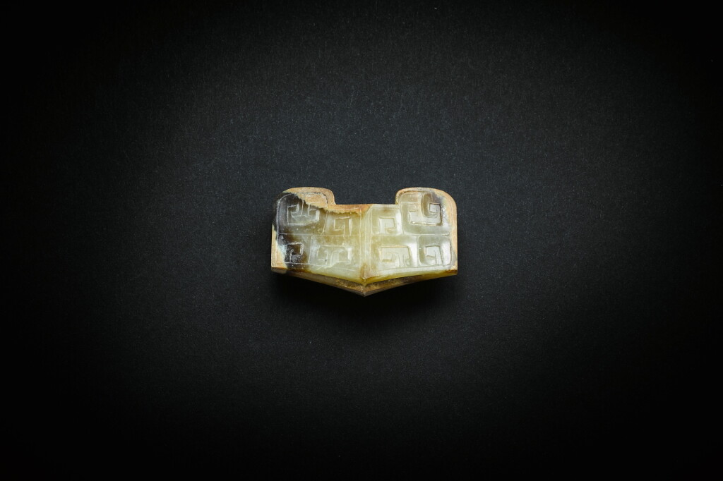 View full screen - View 1 of Lot 3838. A pale greyish-celadon jade sword guard, Eastern Zhou dynasty, late Warring States period - early Western Han dynasty | 東周戰國晚期至西漢早期 淺青灰白玉劍格.
