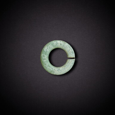 View full screen - View 1 of Lot 3482. A green jade ring, jue, Neolithic period, Hongshan culture | 新石器時代 紅山文化 青玉玦.
