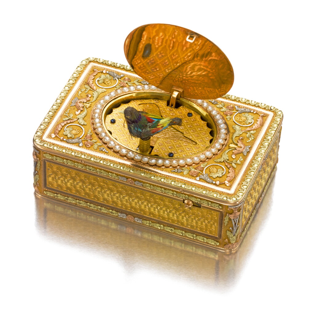 View full screen - View 1 of Lot 707. A VARICOLOR GOLD, ENAMEL, AND PEARL SINGING BIRD SNUFF BOX WITH KEY, THE MOVEMENT BY FRÈRES ROCHAT, THE BOX CHENEVARD JOUVET & CIE, GENEVA, CIRCA 1820.