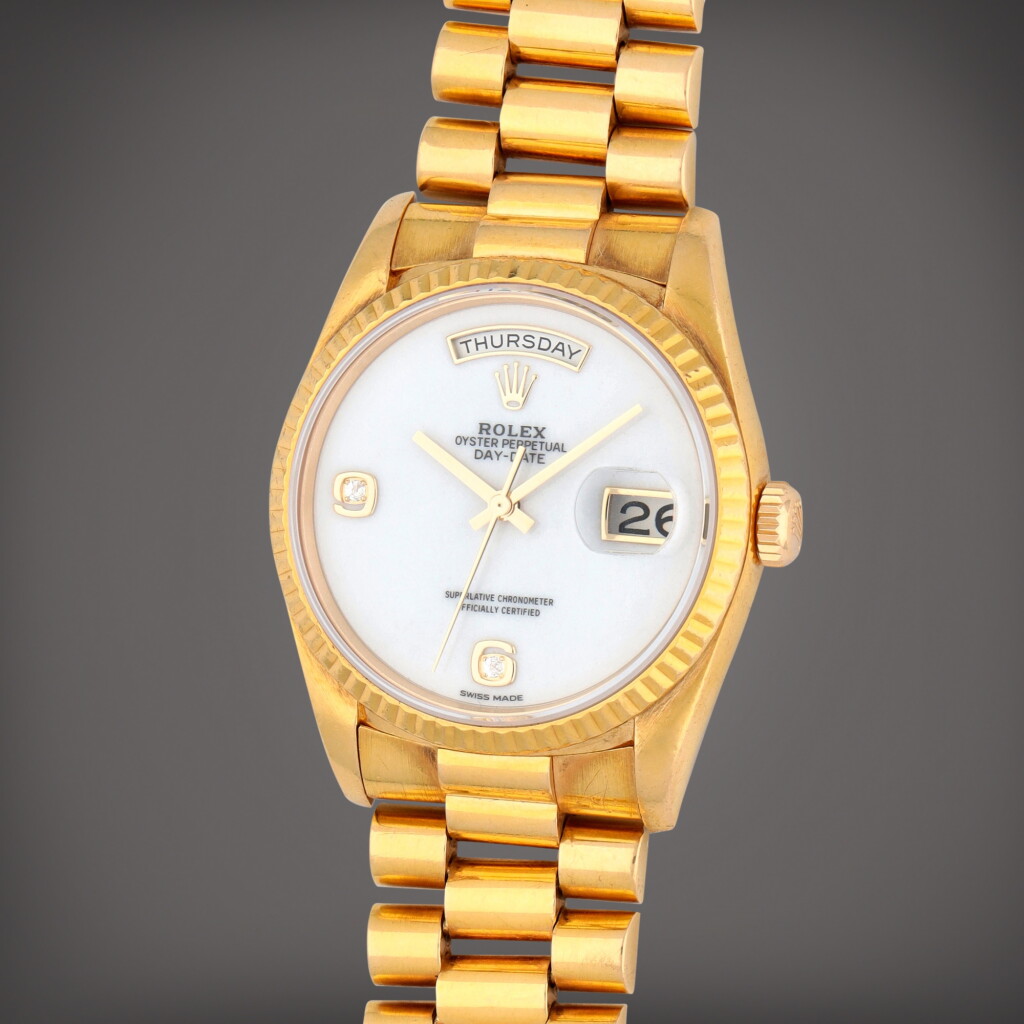 View full screen - View 1 of Lot 50. Day-Date, Reference 18238 A yellow gold wristwatch with day, date, bracelet and cacholong and diamond-set dial Circa 1988.