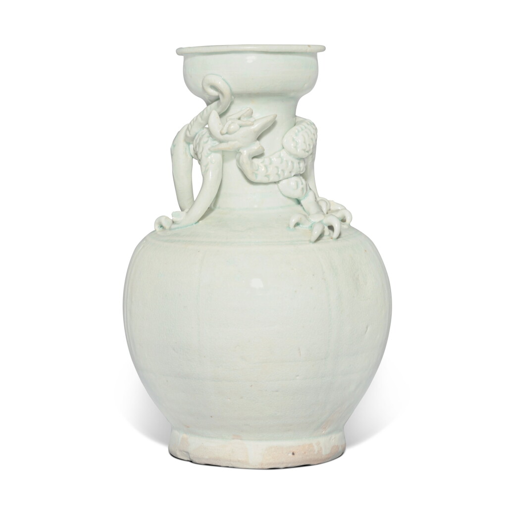 View full screen - View 1 of Lot 729. A Qingbai 'dragon' vase, Southern Song dynasty | 南宋 青白釉貼蟠龍瓜棱盤口瓶.