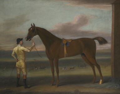 View full screen - View 1 of Lot 129. JOHN WOOTTON | A dark chestnut racehorse held by a jockey, by the rubbing down house, Newmarket Heath.