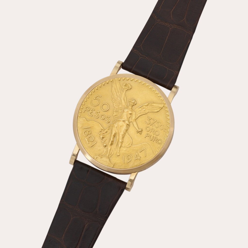 Voir en plein écran - Voir 1 du lot 104. ’50 Pesos’, Reference 3612 | An oversized pink and yellow gold coin wristwatch Made in 10 pieces to commemorate the 100th anniversary of the Treaty of Cordoba | Circa 1971.