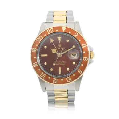 View full screen - View 1 of Lot 9235. Rolex | GMT-Master 'Root Beer', Reference 16753, A yellow gold and stainless steel dual time zone wristwatch with tropical dial, date and bracelet, Circa 1980 | 勞力士 | GMT-Master 'Root Beer' 型號16753 黃金及精鋼兩地時間鏈帶腕錶,備日期及棕式錶盤,約1980年製.