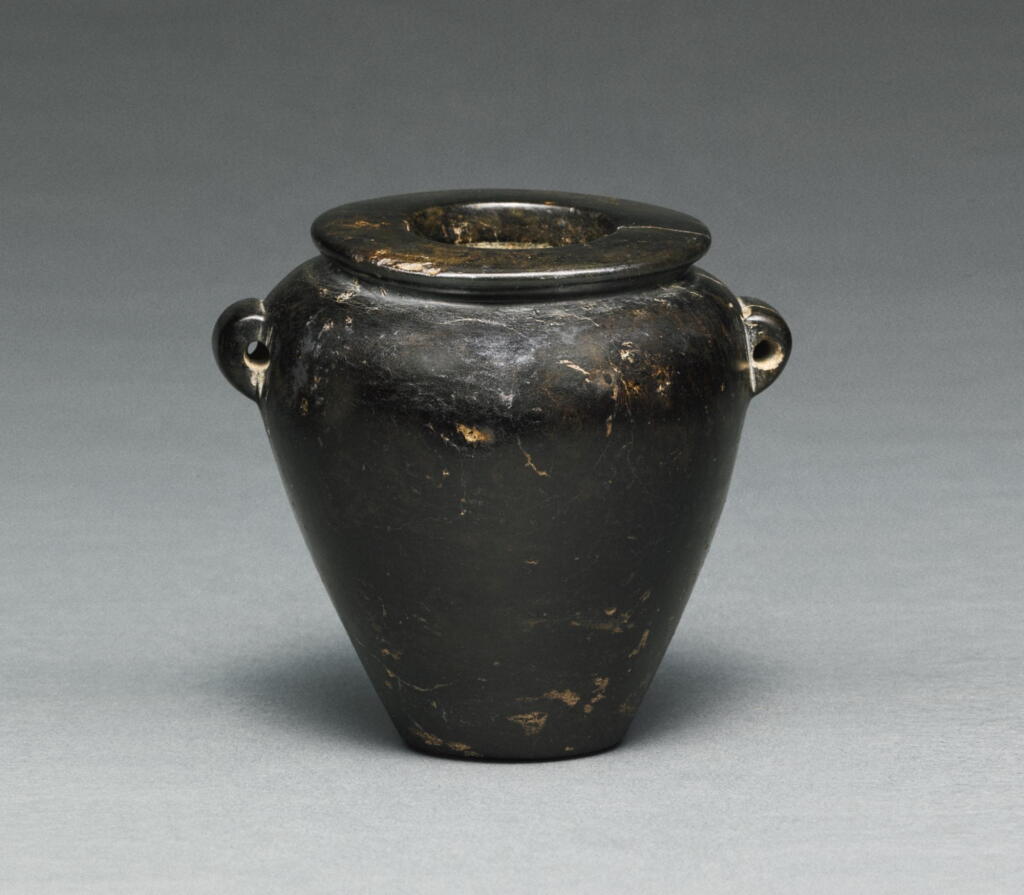 View full screen - View 1 of Lot 52. AN EGYPTIAN BROWN AND BLACK SERPENTINE JAR, LATE PREDYNASTIC PERIOD, CIRCA 3500-3200 B.C..