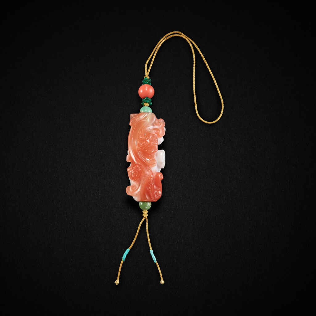 View full screen - View 1 of Lot 892. A carnelian agate double 'chilong' pendant, Qing dynasty, 18th century | 清十八世紀 南紅瑪瑙巧雕螭龍墜.