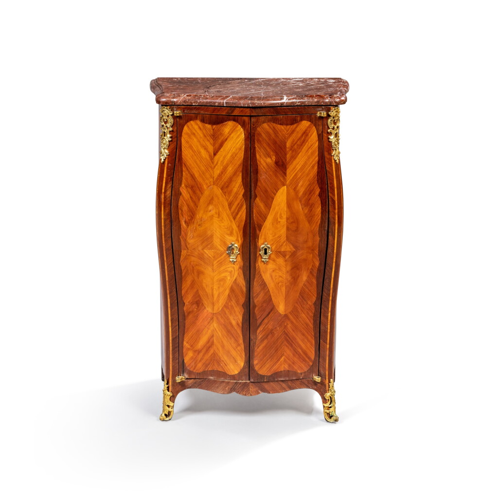 View full screen - View 1 of Lot 802. A Louis XV gilt-bronze-mounted amaranth and tulipwood cabinet, circa 1760, stamped by Pierre Denizot .