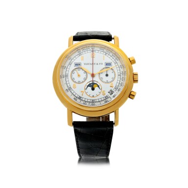 View full screen - View 1 of Lot 13. RETAILED BY TIFFANY & CO.: A YELLOW GOLD AUTOMATIC TRIPLE CALENDAR CHRONOGRAPH WRISTWATCH WITH MOON PHASES, CIRCA 1990.