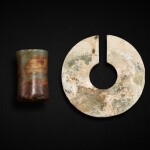 A celadon jade slit ring, jue, and a celadon jade tubular bead, Neolithic period - early Shang dynasty | 新石器時代至商早期 青玉管及玉玦