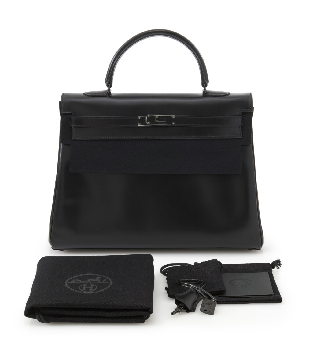 Voir en plein écran - Voir 1 du lot 37. A limited edition, black calf box leather with black hardware, So Black, Kelly 35 with black hardware, Hermès, 2010.