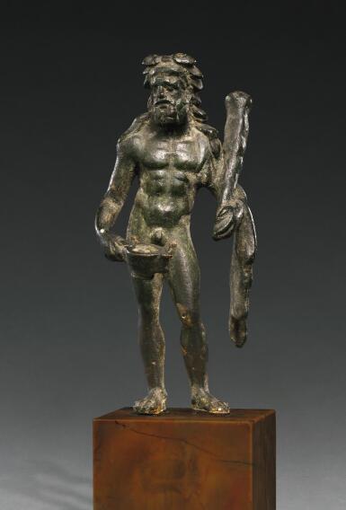 View full screen - View 1 of Lot 12. A ROMAN BRONZE FIGURE OF HERAKLES BIBAX, CIRCA 1ST CENTURY A.D..