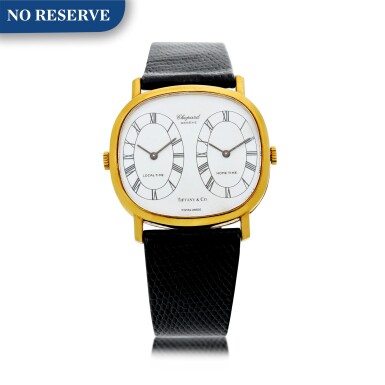 View full screen - View 1 of Lot 12. REFERENCE 2104 1 RETAILED BY TIFFANY & CO.: A YELLOW GOLD DUAL TIME WRISTWATCH, CIRCA 1990.