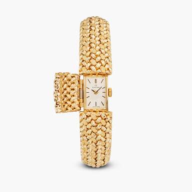View full screen - View 1 of Lot 97. A yellow gold concealed dial bracelet watch, Circa 1970s.