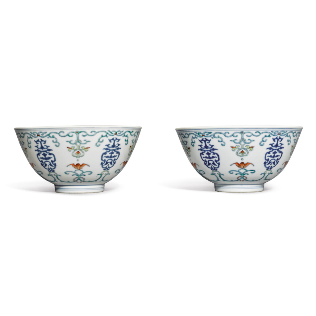 View full screen - View 1 of Lot 563. A PAIR OF DOUCAI 'SHOU AND BAT' BOWLS, QIANLONG SEAL MARKS AND PERIOD.