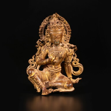 View full screen - View 1 of Lot 651. A gilt copper alloy seated figure of Manjushri, Nepal, circa 16th / 17th century.