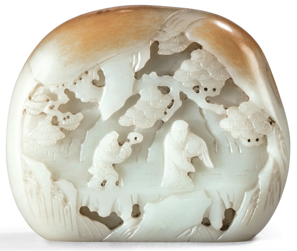 View full screen - View 1 of Lot 57. ROCHER EN JADE CÉLADON PÂLE SCULPTÉ ET ROUILLE DYNASTIE QING, XVIIIE SIÈCLE | 清十八世紀 青白玉雕松下壽老圖山子| A well-carved pale celadon and russet jade boulder, Qing Dynasty, 18th century.