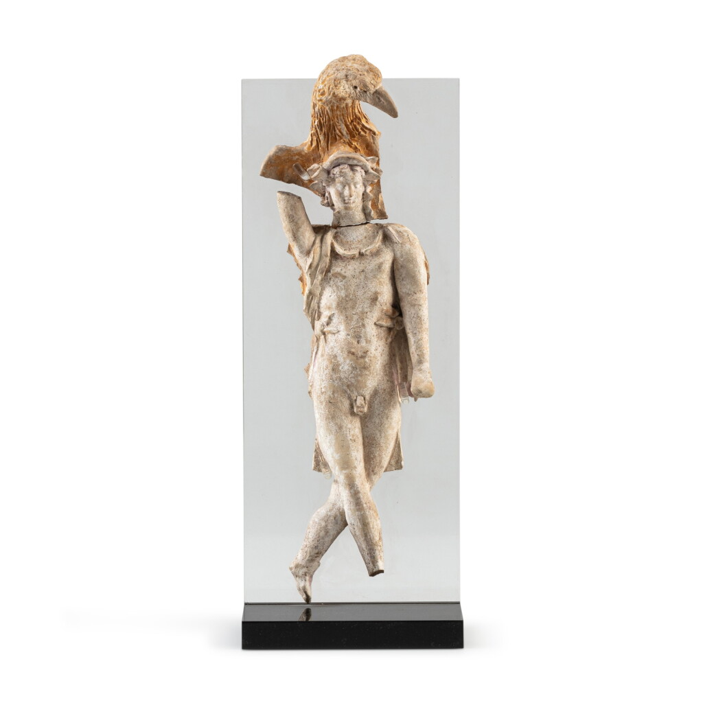 View full screen - View 1 of Lot 53. A Greek terracotta applique of Ganymede and the Eagle, 3rd/2nd Century B.C. | Applique en terre cuite représentant le rapt de Ganymède, art grec, IIIe/IIe siècle avant J.-C..