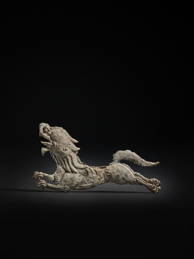 View full screen - View 1 of Lot 216. An exceedingly rare lead 'mythical beast' ornament plaque, Tang dynasty | 唐 鉛異獣紋飾片.