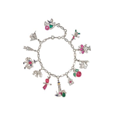 View full screen - View 1 of Lot 121. Platinum, Diamond and Gem-Set Charm Bracelet, Three Charms by Cartier.