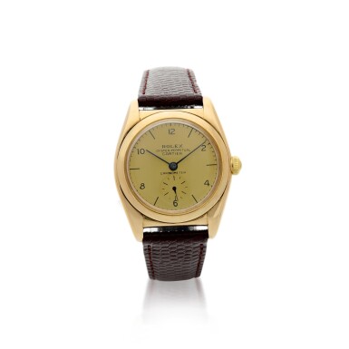 View full screen - View 1 of Lot 168. ROLEX | REFERENCE 3130 OYSTER PERPETUAL 'BUBBLEBACK' RETAILED BY CARTIER: A YELLOW GOLD AUTOMATIC WRISTWATCH, CIRCA 1940.