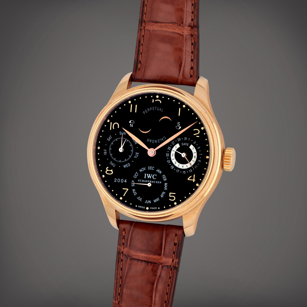 View full screen - View 1 of Lot 425. Portuguese, Reference 502103 | A pink gold perpetual calendar wristwatch with Northern and Southern hemisphere moon phases, power reserve and year indication | Circa 2004.