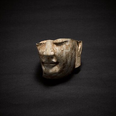 View full screen - View 1 of Lot 301. A stone fragmentary head of a Buddha, Tang dynasty | 唐 石雕佛頭殘像 .