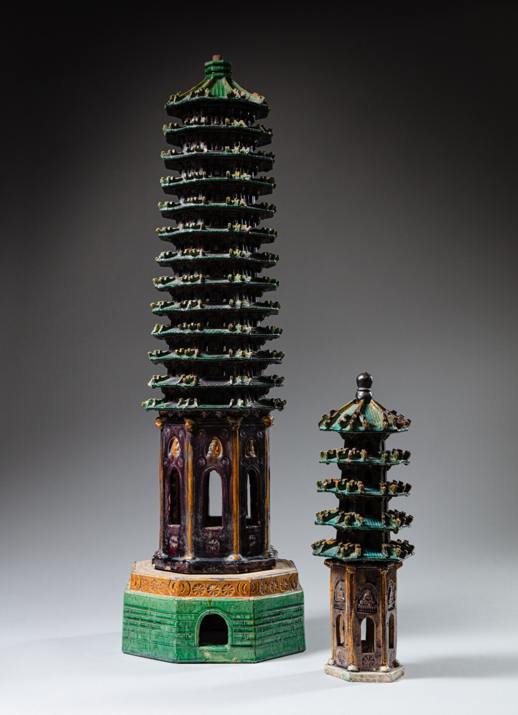 View full screen - View 1 of Lot 107. Two large sancai-glazed storeyed pagodas, Early Qing dynasty | 清初 素三彩佛塔一組兩件.